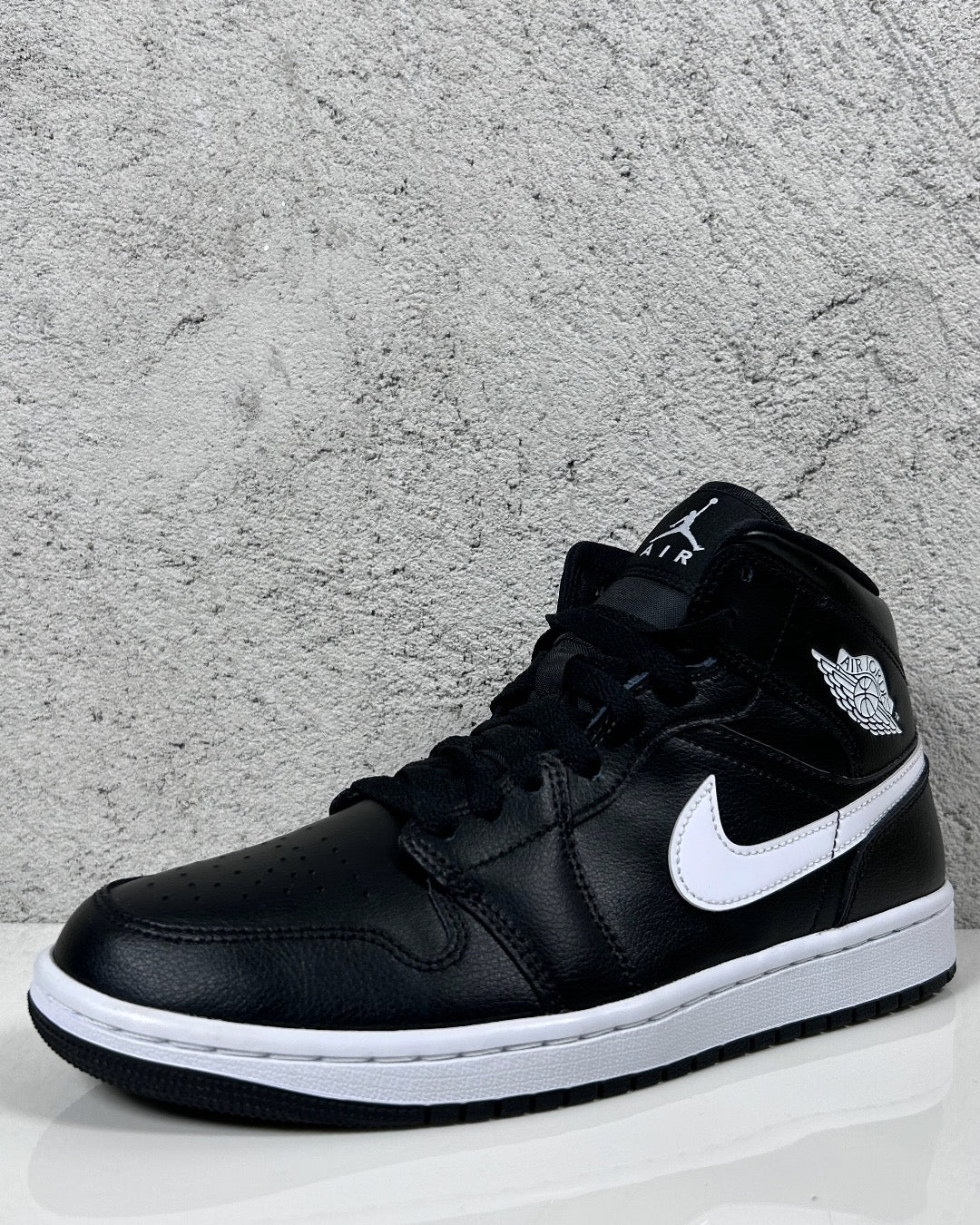 Cheapest black and white jordan 1 mid